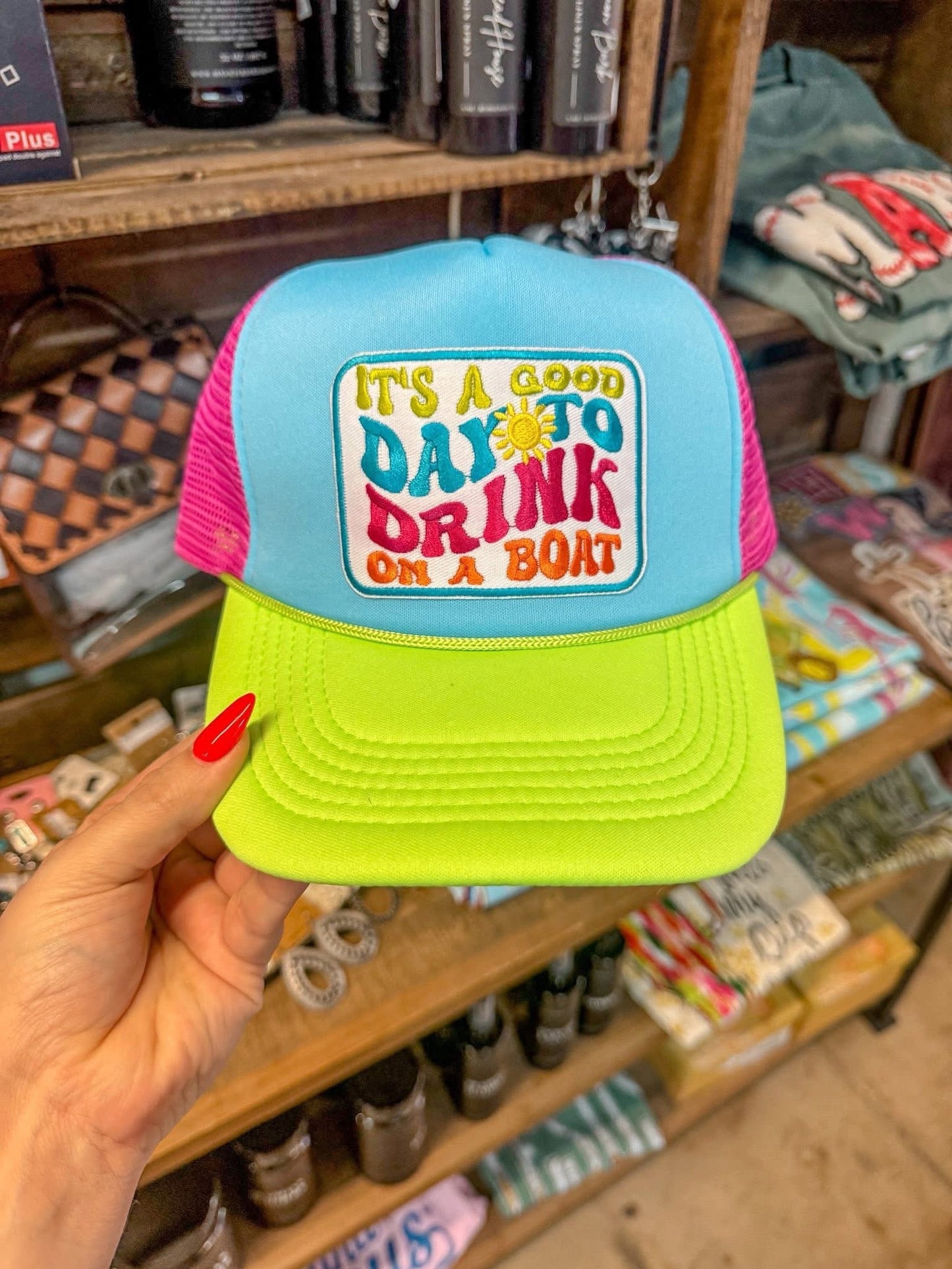NEON DRINK ON A BOAT TRUCKER HAT